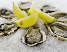 Oysters and lemon wedges